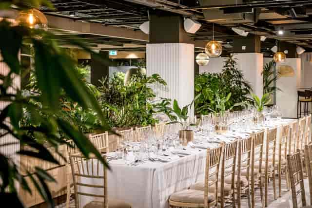 Elegant event space in Central London with banquet table, perfect for corporate gatherings.