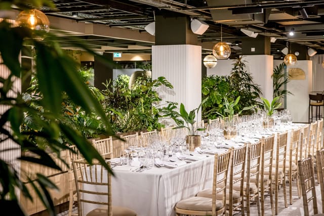 Elegant event space in Central London with banquet table, perfect for corporate gatherings.