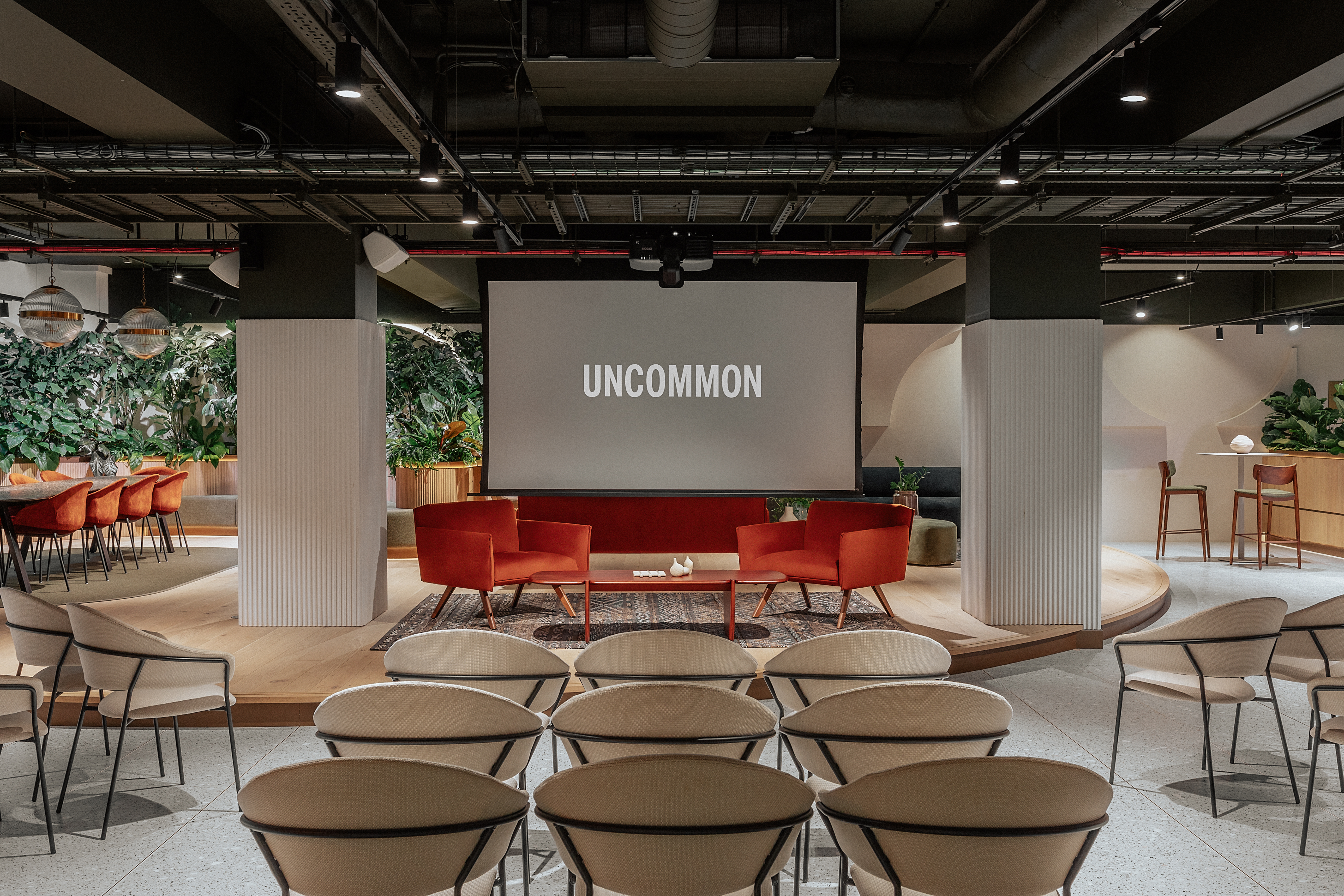Central London event space with vibrant red chairs, ideal for workshops and conferences. - Banner