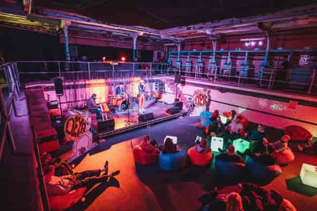 Victoria Baths Females Pool experiential event with beanbag seating and performance lighting.