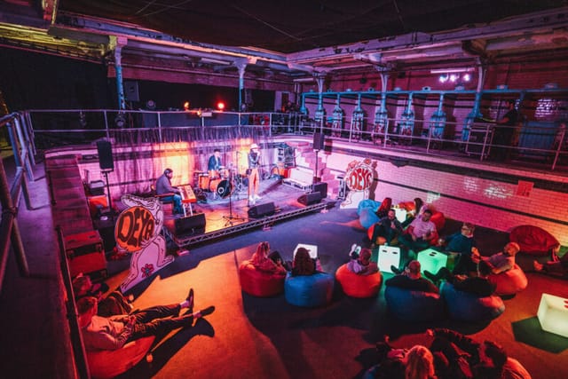 Victoria Baths Females Pool experiential event with beanbag seating and performance lighting.