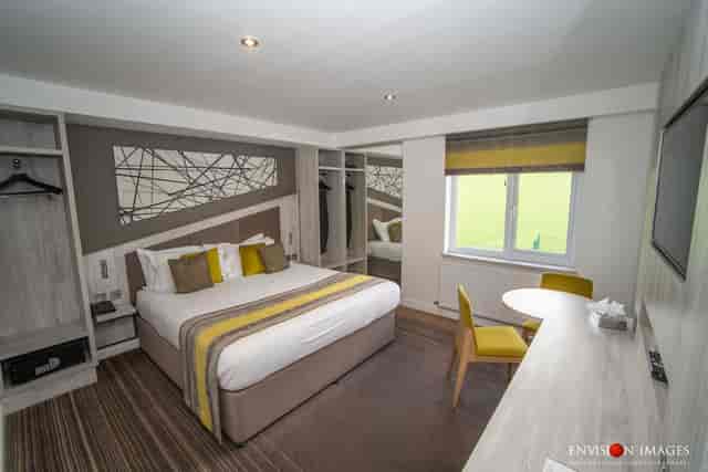 Modern Holcombe Suite at Red Hall Hotel with workspace for business travel and corporate events.