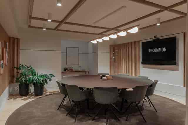 Modern meeting room at Uncommon Holborn with round table for effective collaboration.
