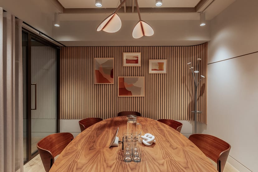 Stylish meeting room with wooden table for intimate gatherings at Uncommon Holborn.