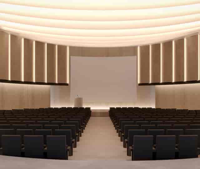 Modern Grand Hall auditorium with ambient lighting for corporate keynotes and professional events.