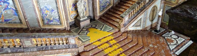 Grand marble staircase in Coudenberg Palace, historic luxury gala event venue.