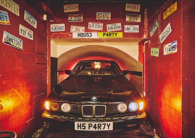 "The Basement venue with vintage car for unique parties and events."