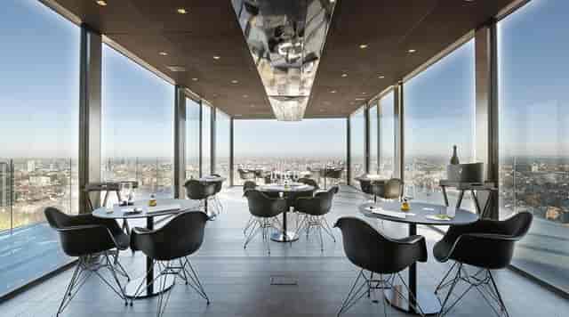 VIP dinner at La Villa in the Sky restaurant with floor-to-ceiling city views.