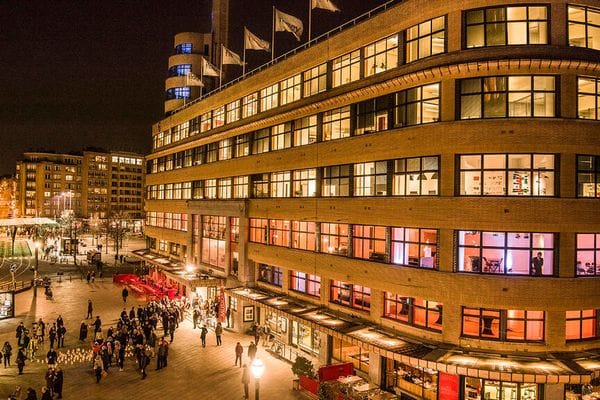 Bustling Cinema Flagey event venue with vibrant architectural lighting for corporate gala nights.