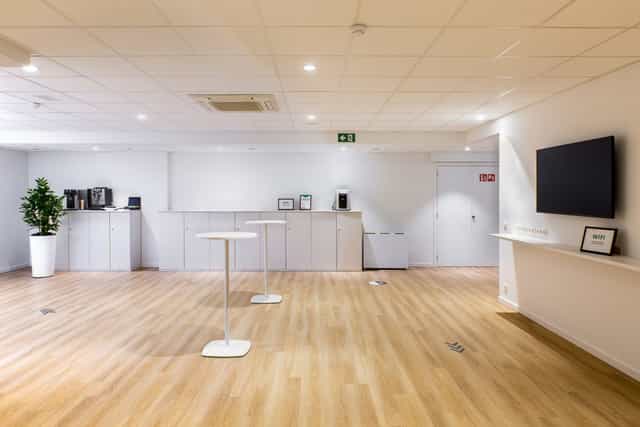 ACE Events breakout room with high-top networking tables for corporate meetings and conferences.