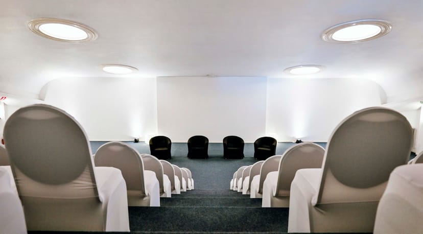 Tiered auditorium at Albert Hall Brussels, ideal for corporate conferences and panel events.