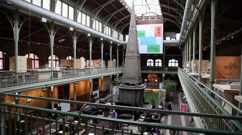 Industrial-chic Halles St-Géry exhibition venue with high ceilings for networking and events.