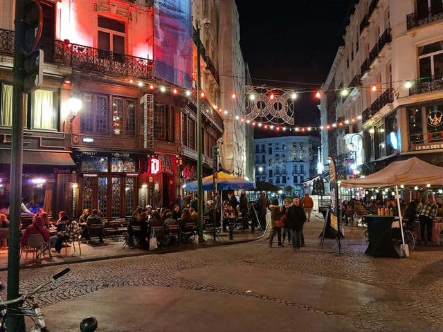 Halles St-Géry exhibition center with string lighting for evening dine-around and welcome reception.