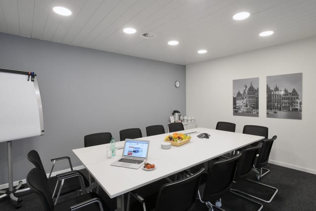 Boardroom meeting room with central table for team breakouts and corporate workshops.