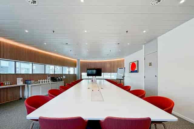 Modern boardroom at (re)space European Quarter with integrated AV for corporate events and meetings.