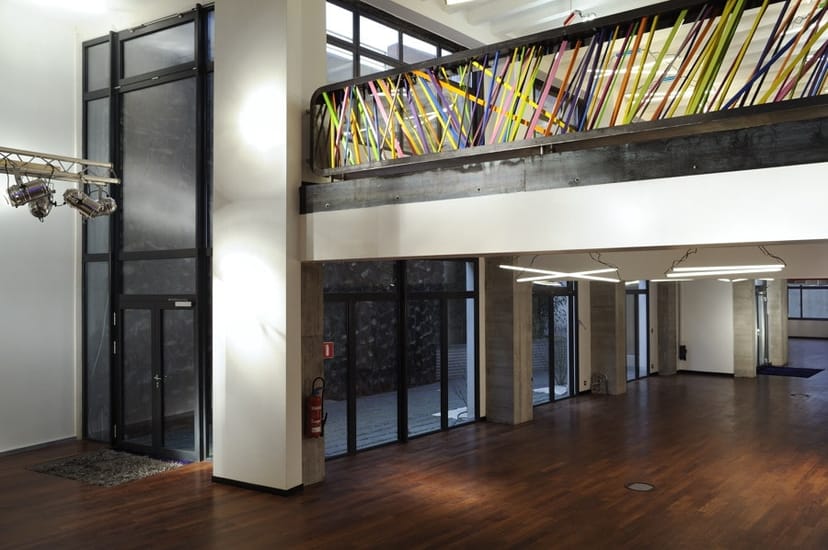 Industrial-chic meeting room with natural light for corporate activations and networking events.
