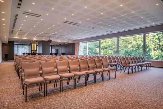 Grand Ballroom theater setup with floor-to-ceiling windows for professional conference seminars.