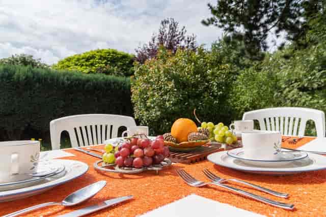 Mismatched plastic seating at a Brussels Expo patio event, catering setup.