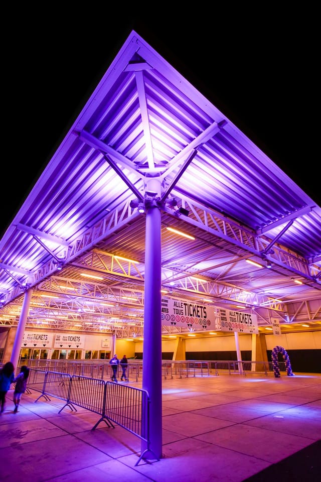 ING Arena concert hall arrival with dramatic up-lighting for event branding and attendee flow.