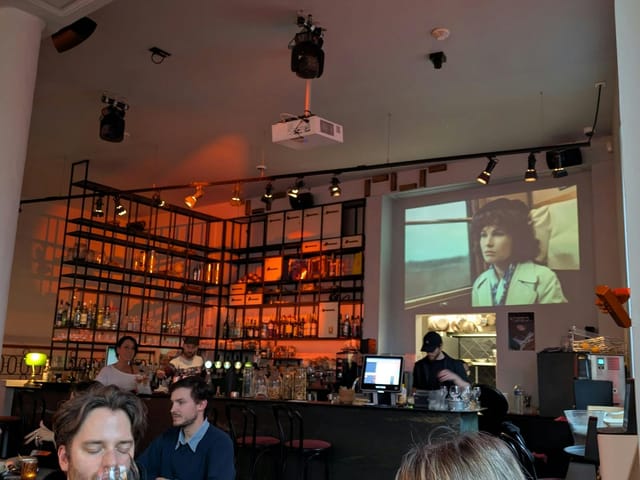 Networking mixer in The Bank restaurant with bar and A/V projection for corporate social events.