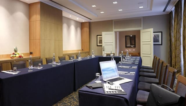 Le Plaza boardroom with U-shape setup for professional business meetings and corporate conferences.