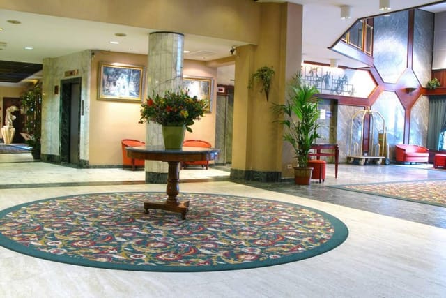 Banquet hall at The Bedford Hotel featuring elegant chandeliers for wedding and corporate events.