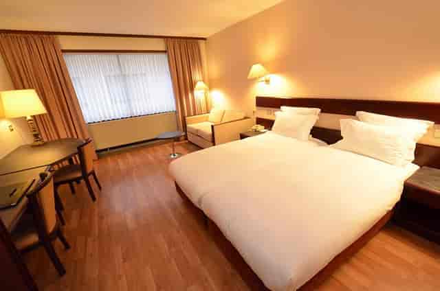 Bedford Hotel convention center room with workspace for corporate events and business meetings.