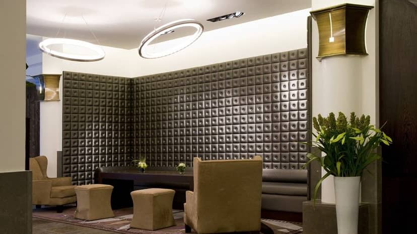 Federico Fellini at Hôtel Marivaux: upscale VIP networking lounge with acoustic wall design.