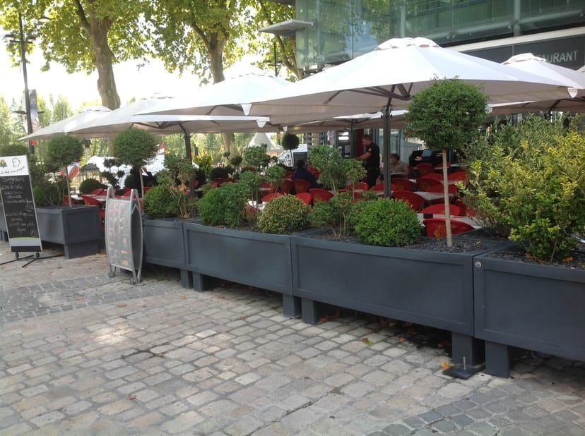 Terra modular outdoor breakout space with tiered planters for networking events and conferences.