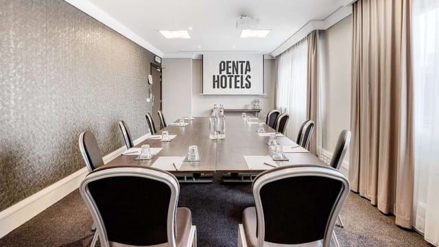 Boardroom-style conference room in Pentahotel Brussels, ideal for business meetings and workshops.