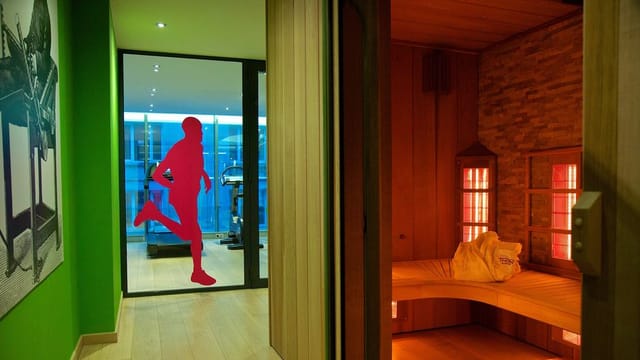 Thon Hotel EU wellness suite with gym and sauna for corporate conference and event recovery.