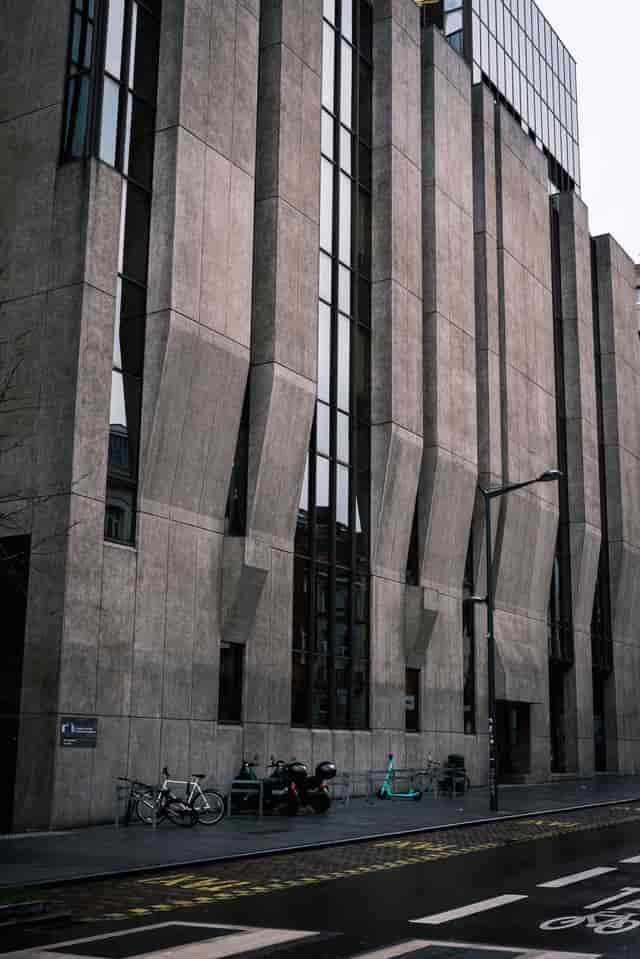 Brutalist conference hall at Albert Borschette Congress Center for high-security business meetings.