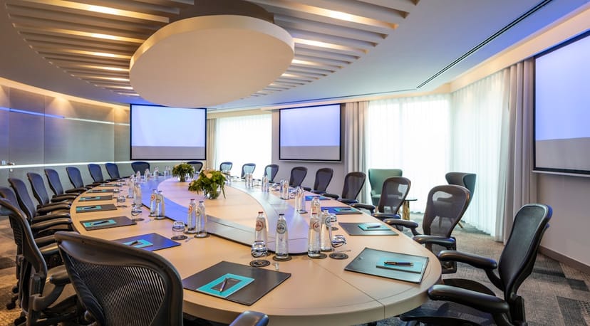 Konrad Adenauer boardroom, elliptical table, professional conference, high-end meeting venue.