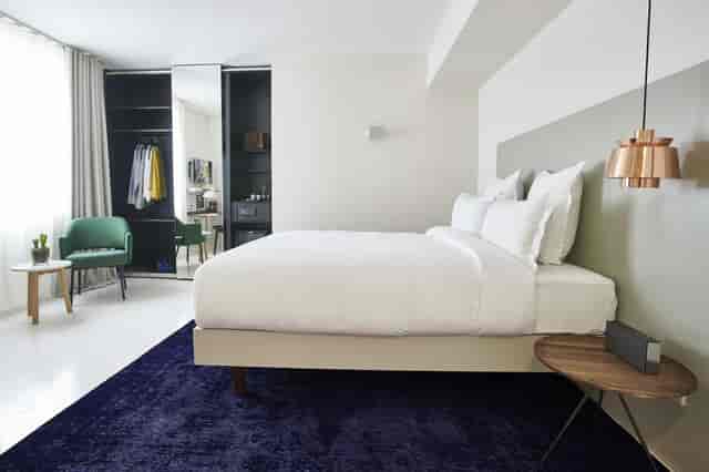 Modern hotel business room with workspace for conference guests and corporate travel.