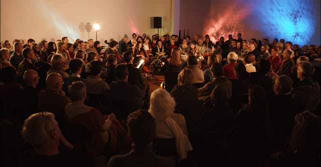 Immersive circular lounge performance setup for intimate corporate event or product launch.