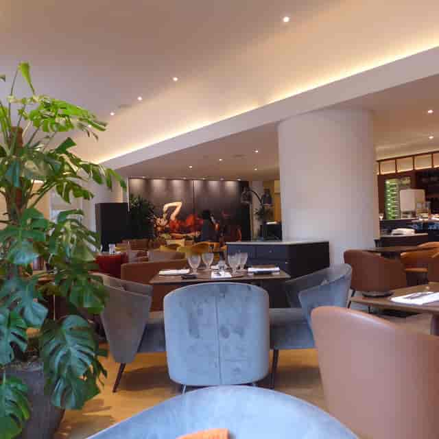 Modern restaurant with velvet decor for corporate networking and VIP dinners in Brussels.