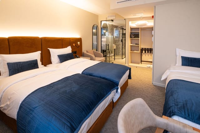 Triple-occupancy suite at The Liman Hotel for conference room blocks and business travel.