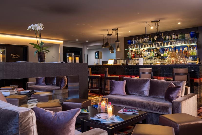 Sophisticated hotel lounge with velvet seating for networking and corporate events.