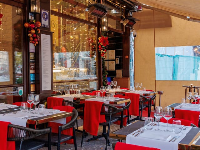 Brasserie in The Dominican patio: festive holiday buyout event space with ambient lighting.