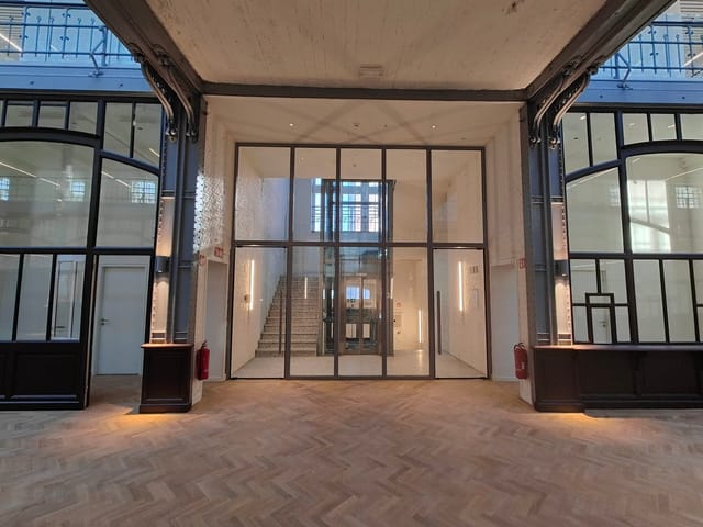 Industrial-chic Hôtel des Douanes venue, hardwood floors for corporate event or networking reception.