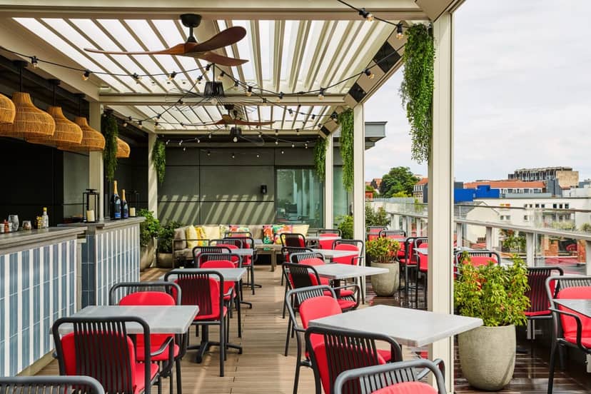 Rooftop bar at The 1040 Etterbeek with ambient lighting for cocktail hours and networking events.