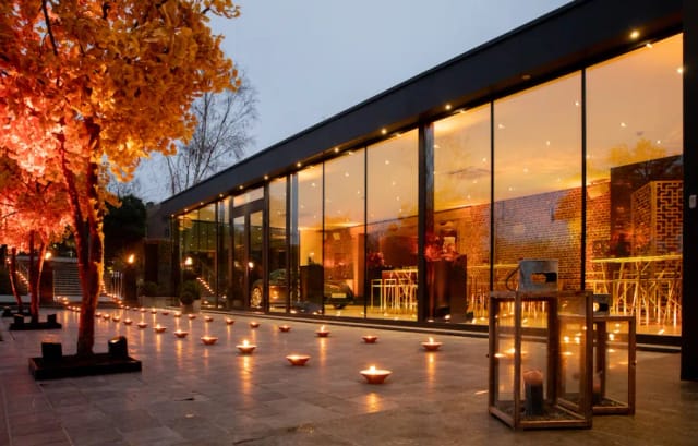 Winter Garden Kattebroek venue with floor-to-ceiling glass for evening receptions and galas.