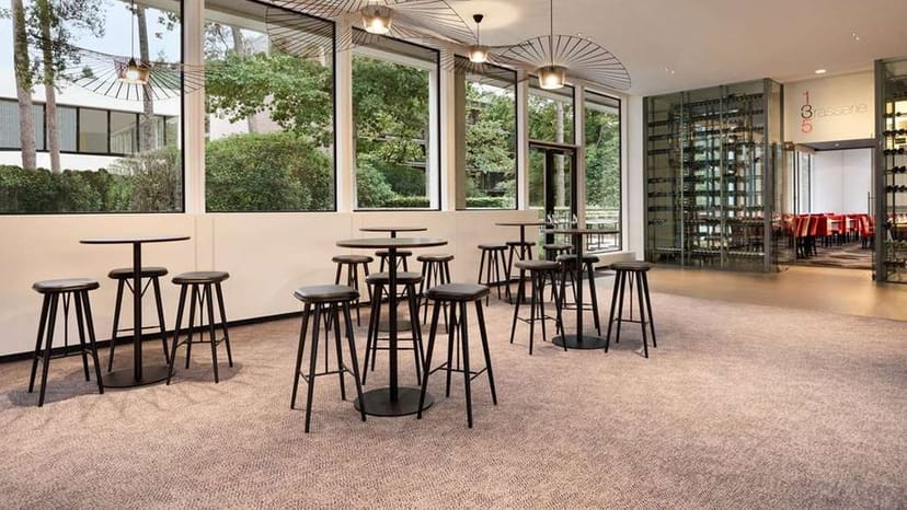 Modern meeting room in the woods, Dolce La Hulpe Brussels, event space and networking lounge.