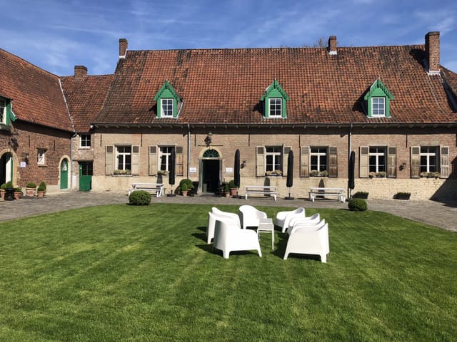 Historic Salons de Romree courtyard with modern lounge furniture for corporate events and seminars.