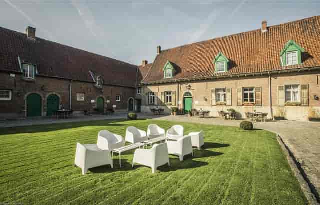 Salons de Romree courtyard: modern lounge furniture for corporate networking and breakout sessions.