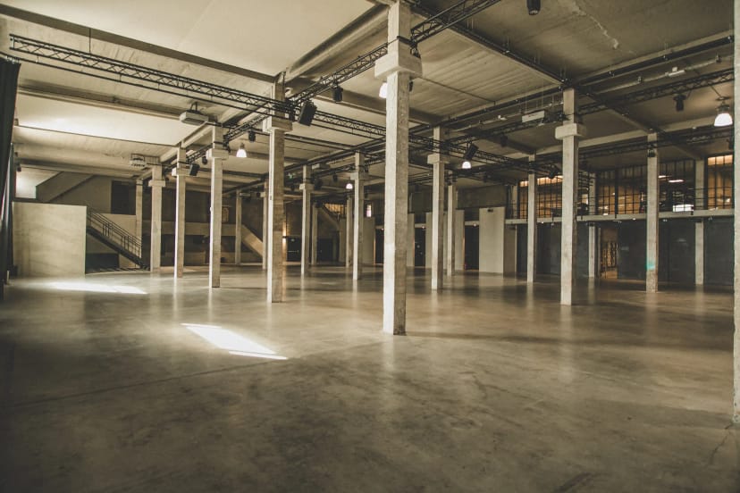 Industrial-chic Meudon event space in Silo Brussels with rigging for blank-canvas venue hire.