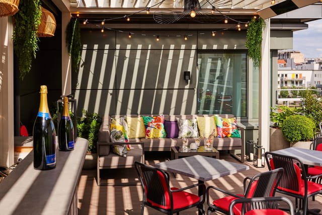 Rooftop venue at The 1040 with ambient string lighting for corporate cocktail and networking events.