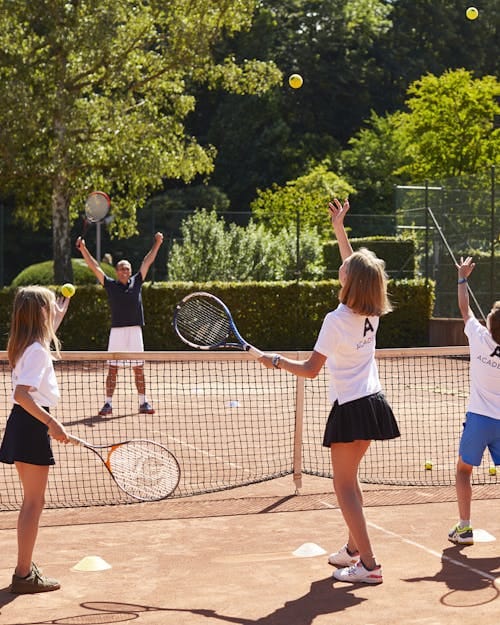Tennis court teambuilding activity at Aspria Royal La Rasante for corporate incentive events.