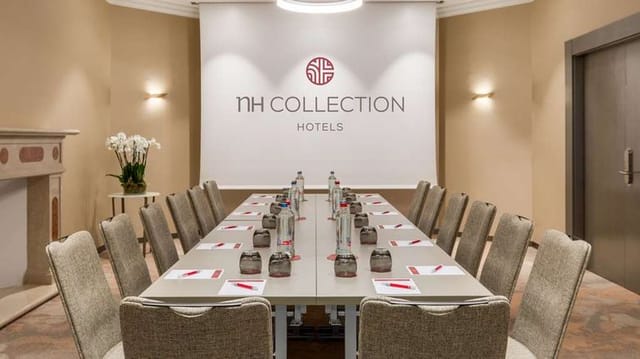 Boardroom meeting setup at NH Collection Brussels Grand Sablon for professional corporate events.