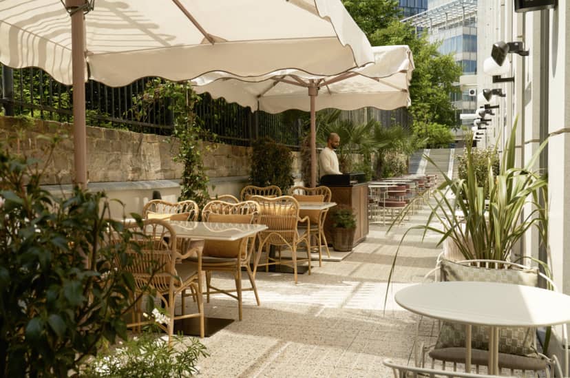 Elegant outdoor event space at The Hox Gallery, Brussels with lush greenery.